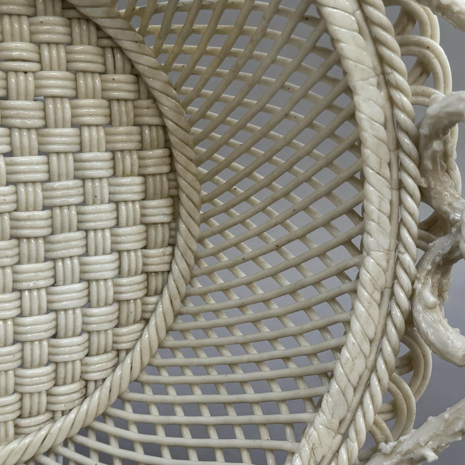 A Belleek two handled circular basket with pierced rim, strap mark to underside Belleek Co - Image 2 of 3