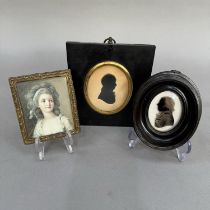 A 19th century silhouette of a gentleman in ebonised frame with hanging loop, 14.5cm x 13cm,