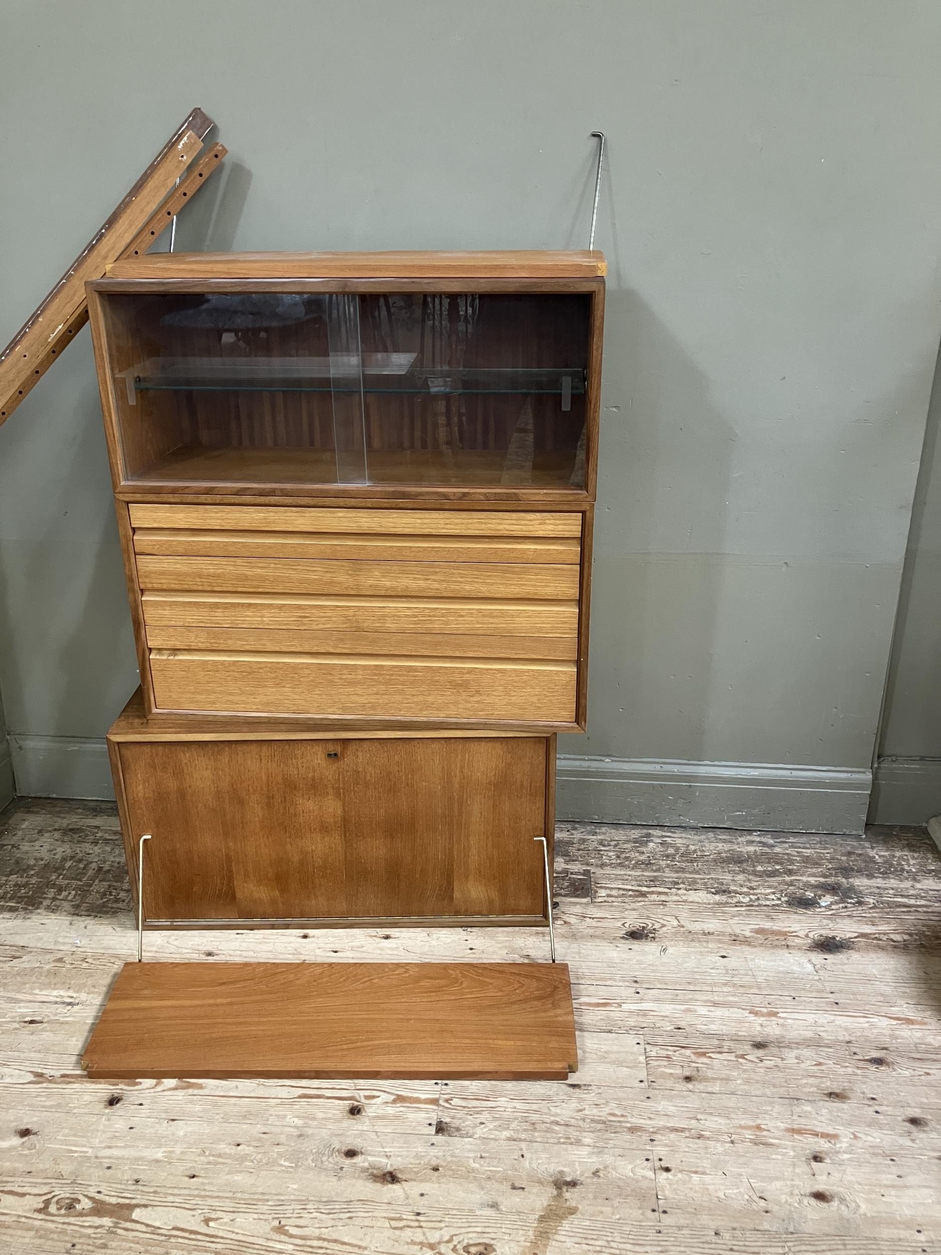 A 1970s style wall hanging unit comprising two shelves, a cupboard unit with sliding glass doors, - Image 2 of 3