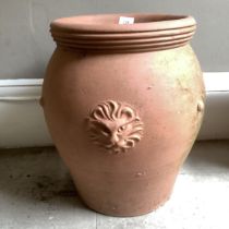 A large terracotta garden pot with lion mask decoration in relief, approximately 44cm high x 40cm