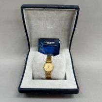 A Longines lady's quartz wristwatch in gilt case no 31490544, matt gilt dial with black batons and