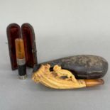 A meerschaum cheroot holder in the form of a fox and chicken with amber style mouthpiece and