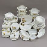 An extensive collection of vintage Pyrex ware decorated with flowers in shades of brown and