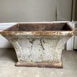 A cast iron planter of rectangular outline and flared profile, 40cm x 28cm x 25cm