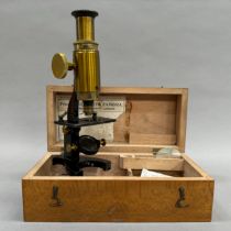 A Negretti and Zambra microscope in wooden case