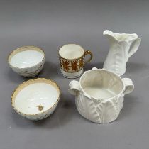 A pair of 18th century china tea bowls of fluted form decorated with a trailing vine to the exterior