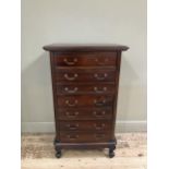 A reproduction hardwood chest of one single drawer and three double fronted drawers with swing