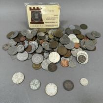 Tub of mainly foreign obsolete currency plus approximate 30gms of foreign silver coins