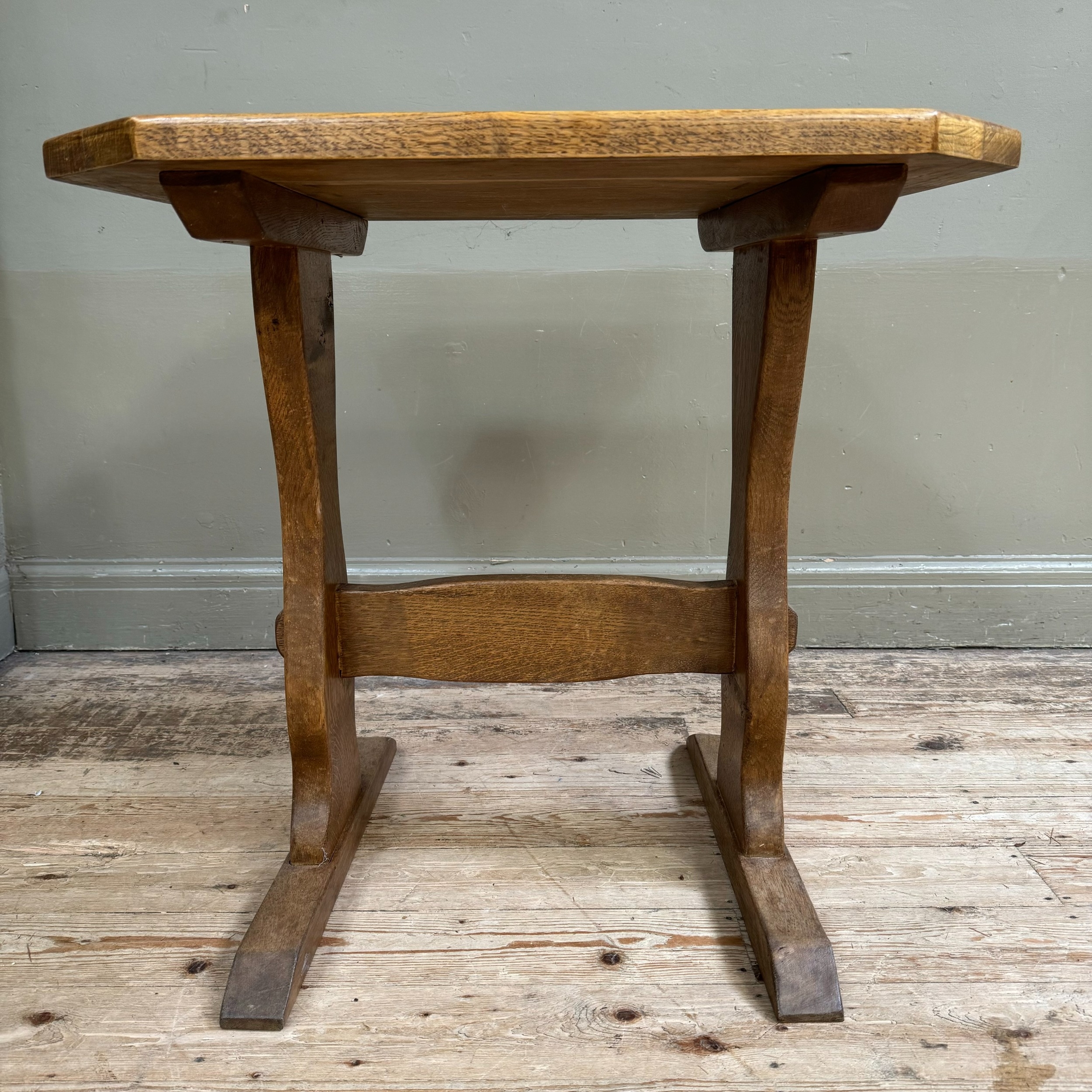 A small oak refectory table on shaped standards joined by a stretcher, 70cm x 64cm x 70cm - Image 2 of 2