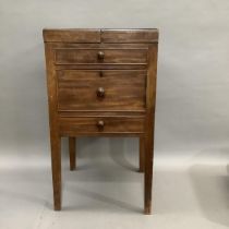 A 19th century mahogany night table having a twin fold out top, later inset board, dummy drawer