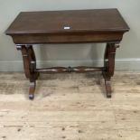 A mahogany rectangular side table on lyre shaped supports and with refectory supports and turned