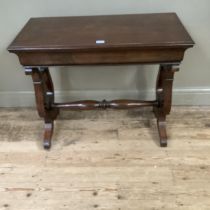 A mahogany rectangular side table on lyre shaped supports and with refectory supports and turned
