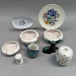 A collection of Poole pottery including three posy bowls, preserve pot, cruet, cream jug and deer