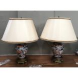 A pair of gilt metal mounted Imari vase shaped table lamp of globular form painted in under glaze