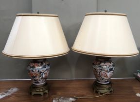 A pair of gilt metal mounted Imari vase shaped table lamp of globular form painted in under glaze