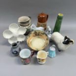 A Rowntree cocoa jug, a Doulton series bowl, a green glaze tapered jug, a pottery sheep, plogh
