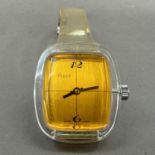 An Agor ladies' manual wristwatch in an oval clear perspex case, Swiss lever movement, rectangular