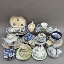 A quantity of blue and white ware including cups and saucers, tea plates, dinner plates, and a Woods
