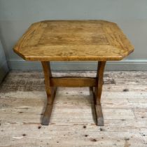 A small oak refectory table on shaped standards joined by a stretcher, 70cm x 64cm x 70cm