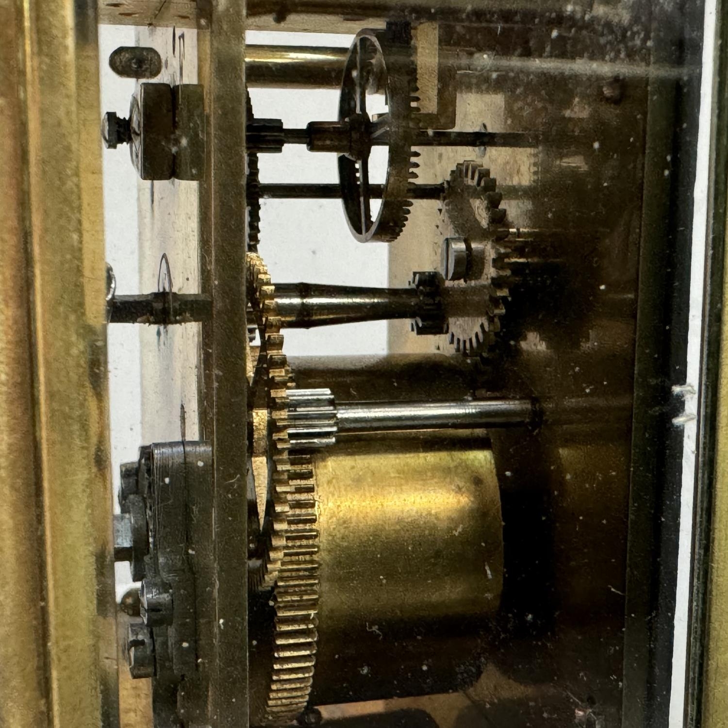 An early 20th century brass carriage clock, enamel dial with black Roman numerals, 13cm over handle - Image 3 of 3