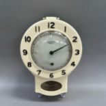 A mid 20th century Smiths Bakelite pendulum wall clock with key