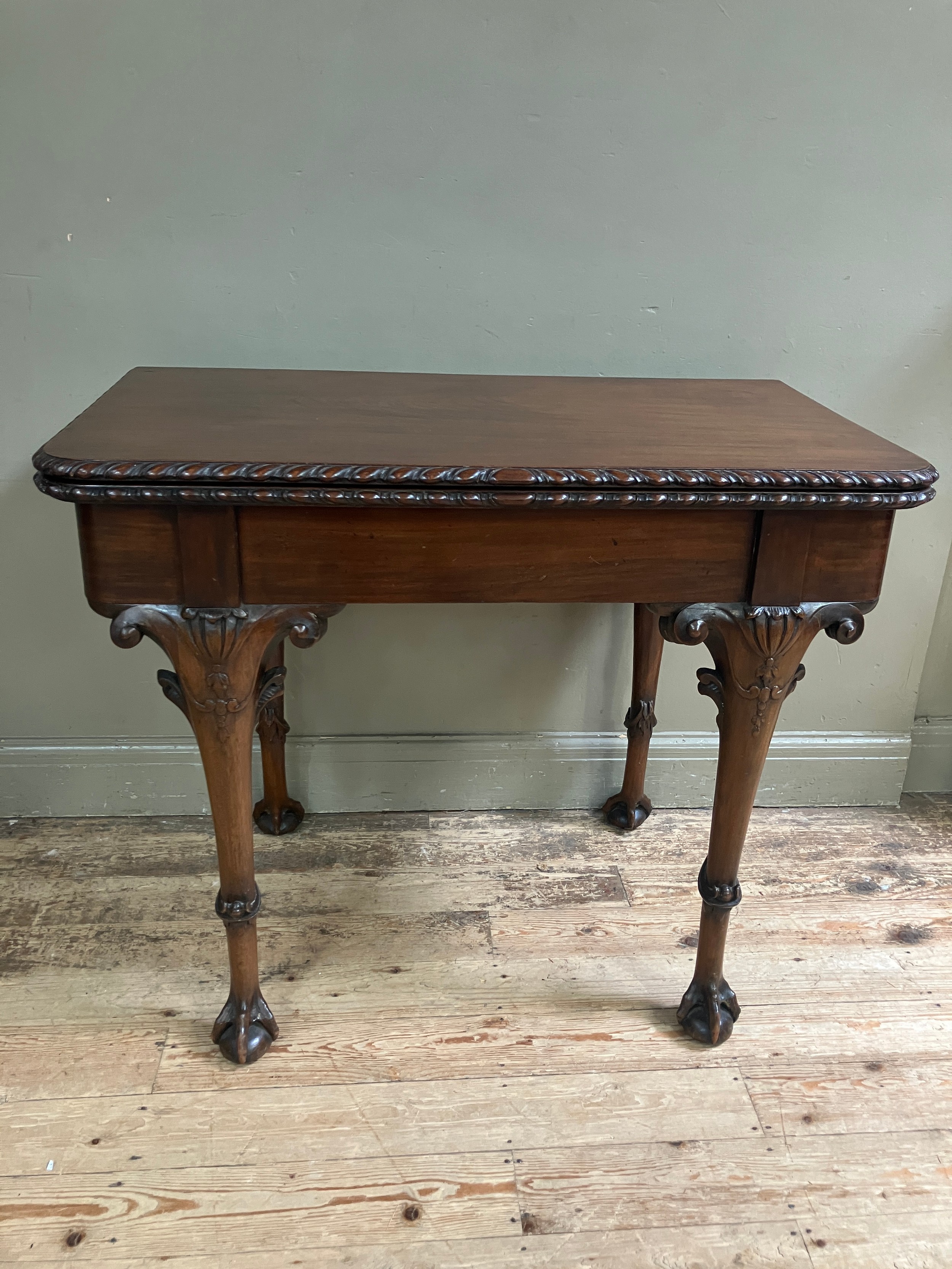 A 19th century Irish mahogany fold over dining table by R Strahan and Co, having carved edge and - Image 8 of 10