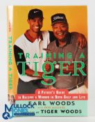Tiger Woods Signed Book, Training Tiger by Earl Woods, a good signature obtained by Murray Bergess