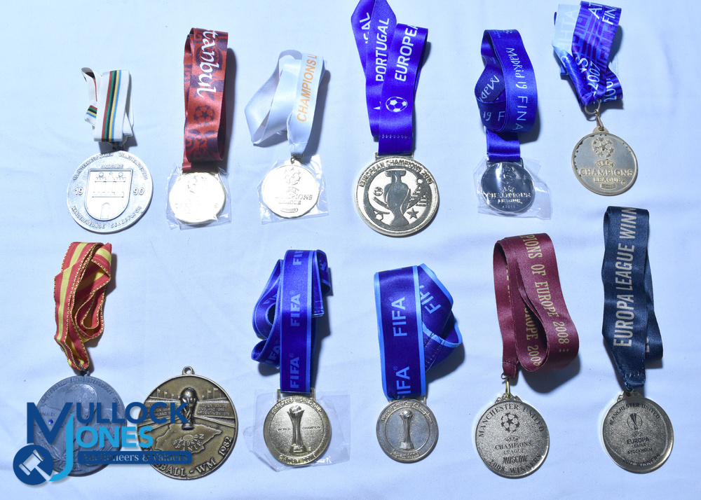 Twelve gilt and chrome replica Football Medals and Lanyards - 1986/1990 World Cup, 2005 Champions