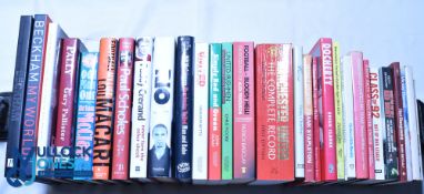 Thirty Manchester United Football Club related books including books signed by Tommy Docherty and