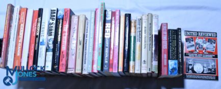 Thirty-one mainly Manchester United Football Club related books including a Bobby Charlton signed