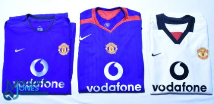 Three Manchester United FC football shirts - 2002-2003 Third Kit, 2005-2006 Away, and 2002-2003