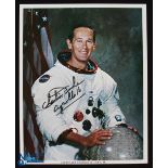 NASA - Charles Duke - Apollo 16 - colour 10x8 showing Duke seated in space suit signed across the