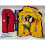 A pair of life preservers: Crewsaver buoyancy aid, looks unused, with instructions and spare bottle.