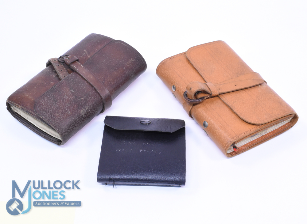 A collection of leather fishing wallets, as follows: Unnamed light tan wallet with wrap around