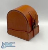 A fine unnamed large block leather 'D' reel case, burgundy lining, 4" x 2", excellent strap,