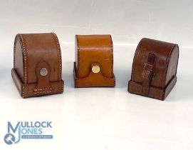 A collection of block leather 'D' shape reel cases, as follows: Unnamed green lined 3.5" case with