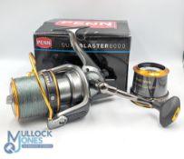 Penn Surfblaster 8000 fixed spool reel with spare spool with foldable handle, appears with little