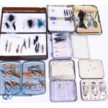 A collection of containers with sea trout and salmon flies: Tin of tube flies. Unnamed black