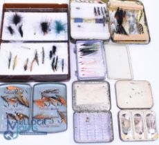 A collection of containers with sea trout and salmon flies: Tin of tube flies. Unnamed black