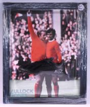 Dennis Law Manchester United Signed Football Boot, a modern black boot framed and mounted in front