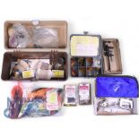 Collection of fly tying materials, including feathers, wools, threads and wax, a Dyna King fly tying