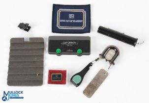 A collection of fishing gadgets, to include: CandF double zinger with Orvis nippers and hook