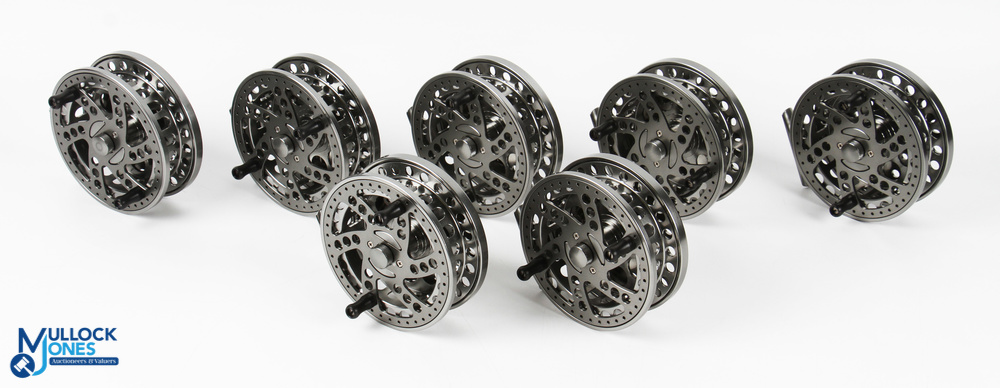 A trader’s lot of 7x unnamed new alloy trotting reels - 4.25” caged spool, twin waisted black