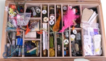 Comprehensive fly tying kit containing threads, silks, hooks, beads and wire, in a lift out tray
