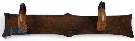 Taxidermy Gun Rack, Sword Stand. Having 2 Deer feet attached to wooden display