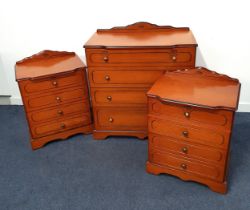 CHERRY VENEER CHEST OF DRAWERS with a shaped raised back above four graduated drawers with carved