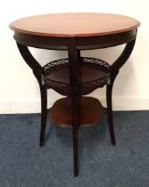 TEAK OCCASIONAL TABLE the circular top with a broad frieze above a circular undertier with a pierced