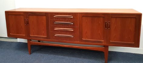 G PLAN TEAK SIDEBOARD with four central drawers flanked by a two pairs of panelled cupboard doors,