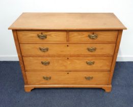 LIGHT OAK CHEST OF DRAWERS with a rectangular moulded top above two short and three long graduated