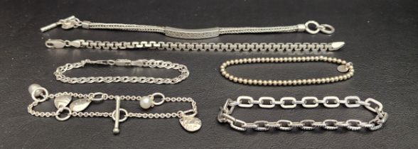 SELECTION OF SIX SILVER BRACELET comprising one by Lois Hill with central scroll decorated panel,